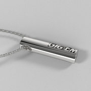 Side view of the GIGEM sterling silver oval tag pendant on a chain.